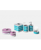 A group of bath accessories in blue sea and purple finish from Saturno Collection.