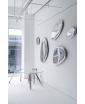A group of Tafla O inox mirrors mounted on the wall