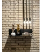 Shiny Silver and Gold Guests Figurines on a shelf. Lifestyle image.