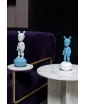 Two The Guest Figurines on side tables. Staged photo.