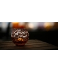 NATALI GLASS CANDLEHOLDER IN ROSALINE Color with the lighted candle in it.