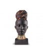 "African Colors" by Lladro, a porcelain bust statue of an African Woman with her hair styled in a braided updo.
