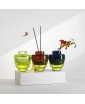 A group of three Toy vessels in various colors.