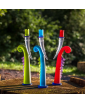 Staged photo showcasing three KING candlesticks in lime, blue and red.