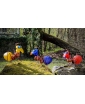 Three AMY outdoor lights in nature, showcasing their different colors in the daylight."