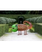 The Chameleon Outdoor Sculpture is displayed in elegant green gardens.