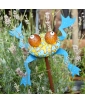 Blue Hopkins Garden Frog Decor perched on a metal stick amidst nature.