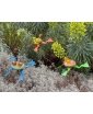 A trio of Hopkins Garden Frog Decor showcased in a natural setting – a lifestyle image.
