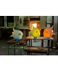 Blue, lime green, and orange Angelfish sculptures displayed in a lifestyle setting.