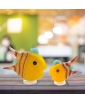 Medium and small angelfish objects feature against the abstract background.