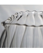 Detail of the Nana clear hand-blown glass carafe, showing curved ribbed surface.
